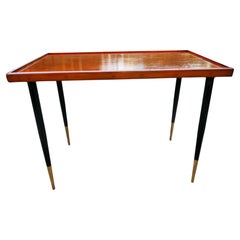 Wooden coffee table with iron legs. The wood has been painted.