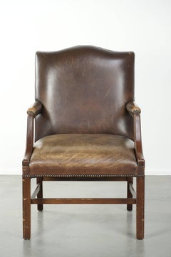 Wooden cow leather English Gainsborough chair with a stunning appearance