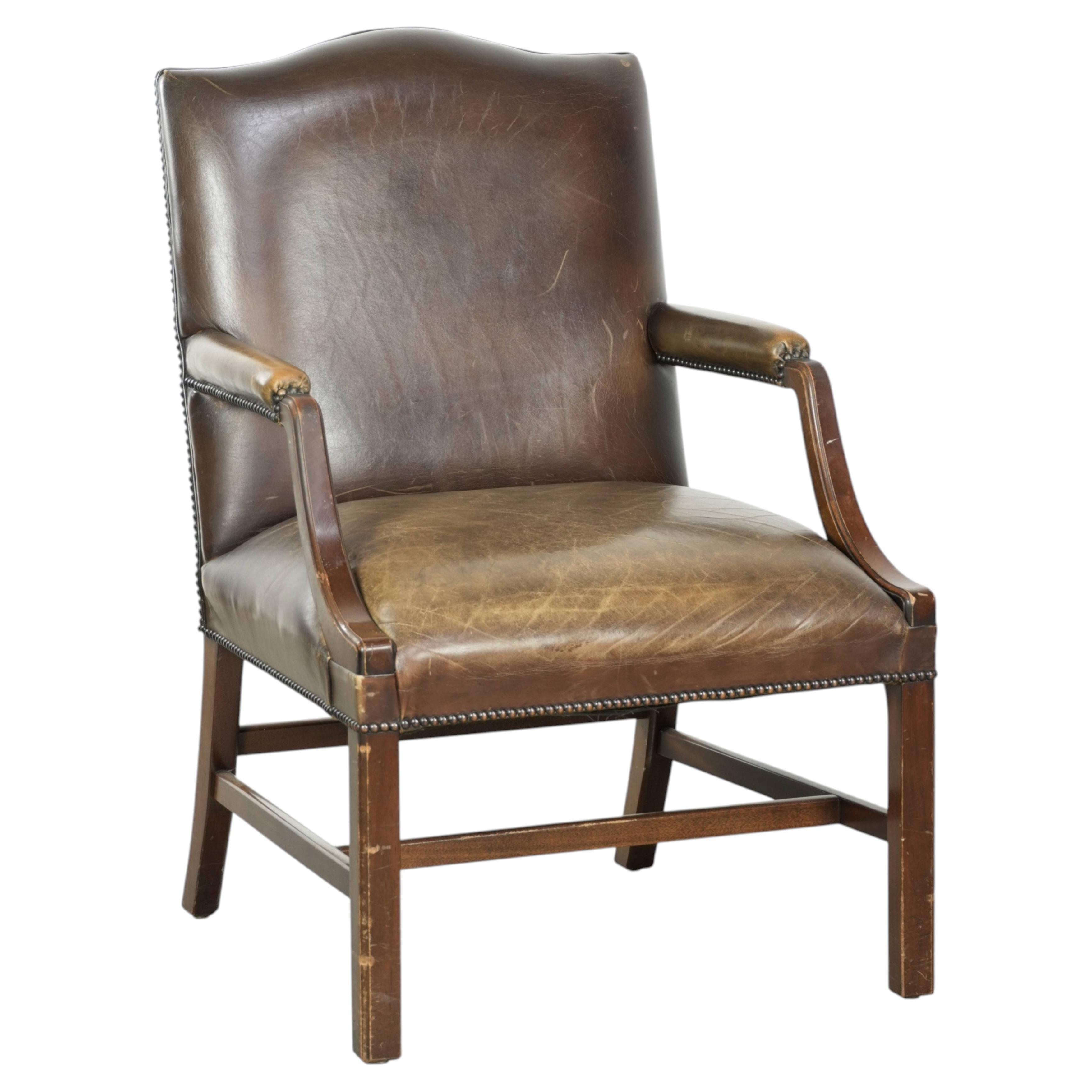 Wooden cow leather English Gainsborough chair with a stunning appearance