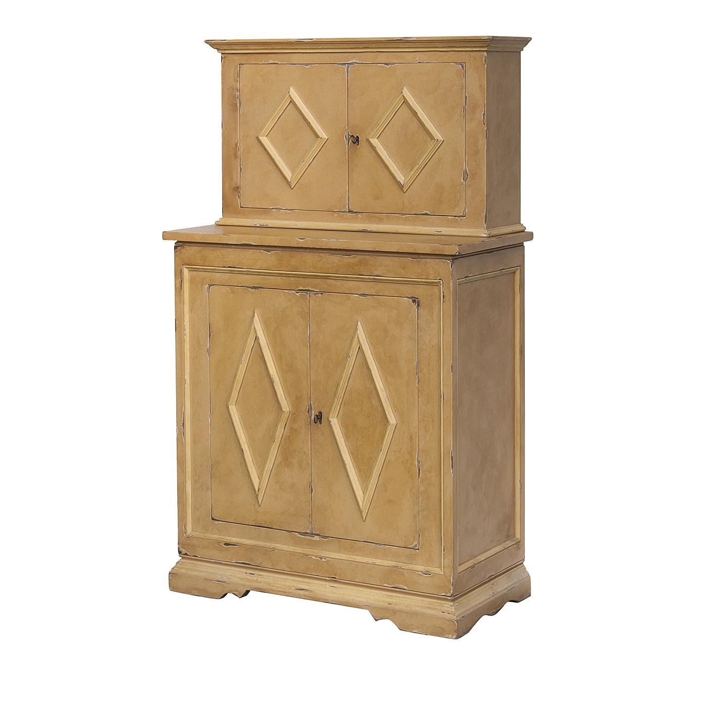 This exquisite cupboard was crated of solid wood and boasts a harmonious silhouette and sober decorations, reminiscent of the classical-inspired Renaissance style. The wood has a multicolored finish with antique orange hues and shows charming signs