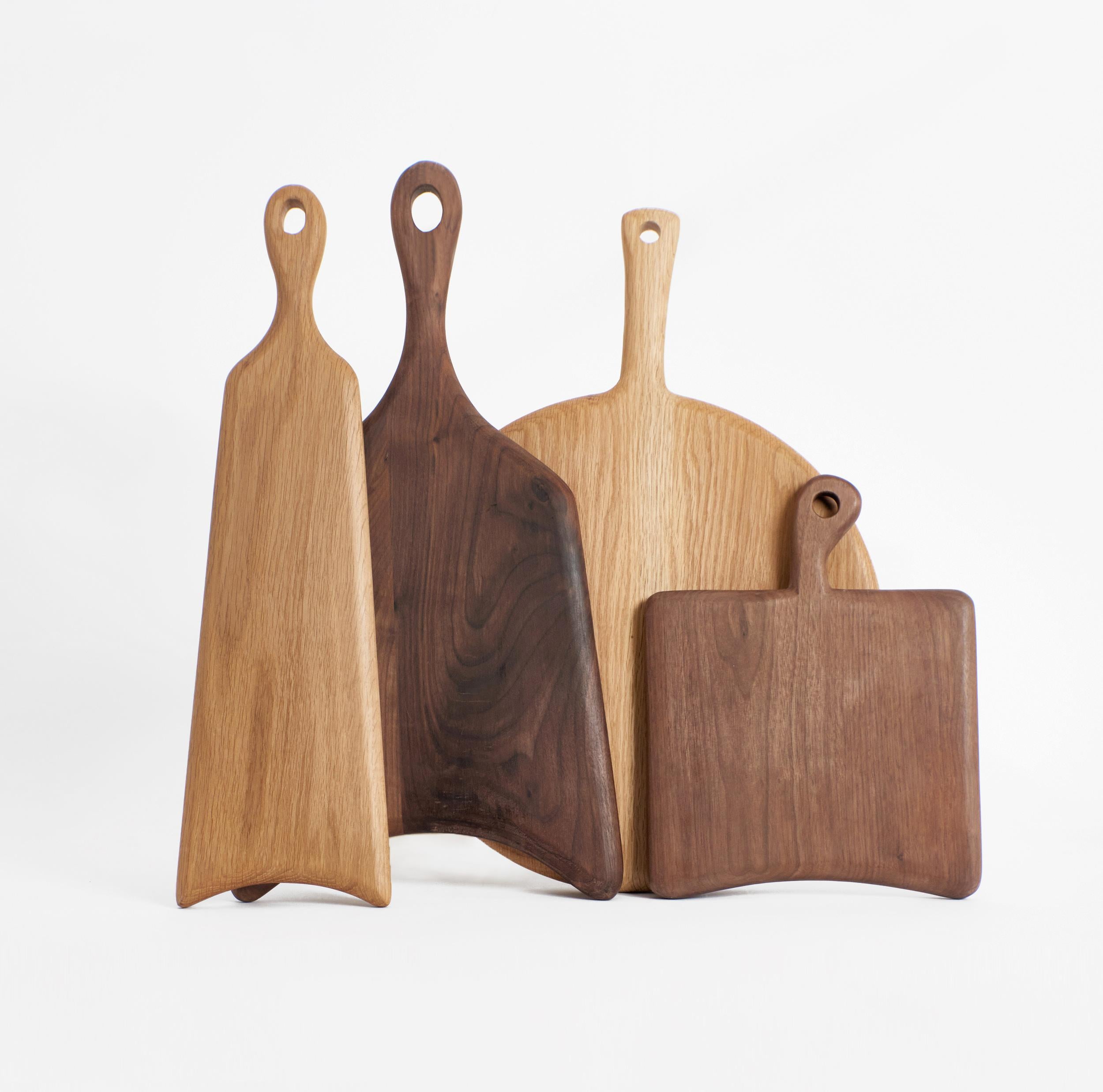 Hand-made wooden board 

This medium square shaped board is hand-carved from oak. The boards as an individual or as part of the family will become a key item in every kitchen being decorative as well as functional. 
Available in three other sizes