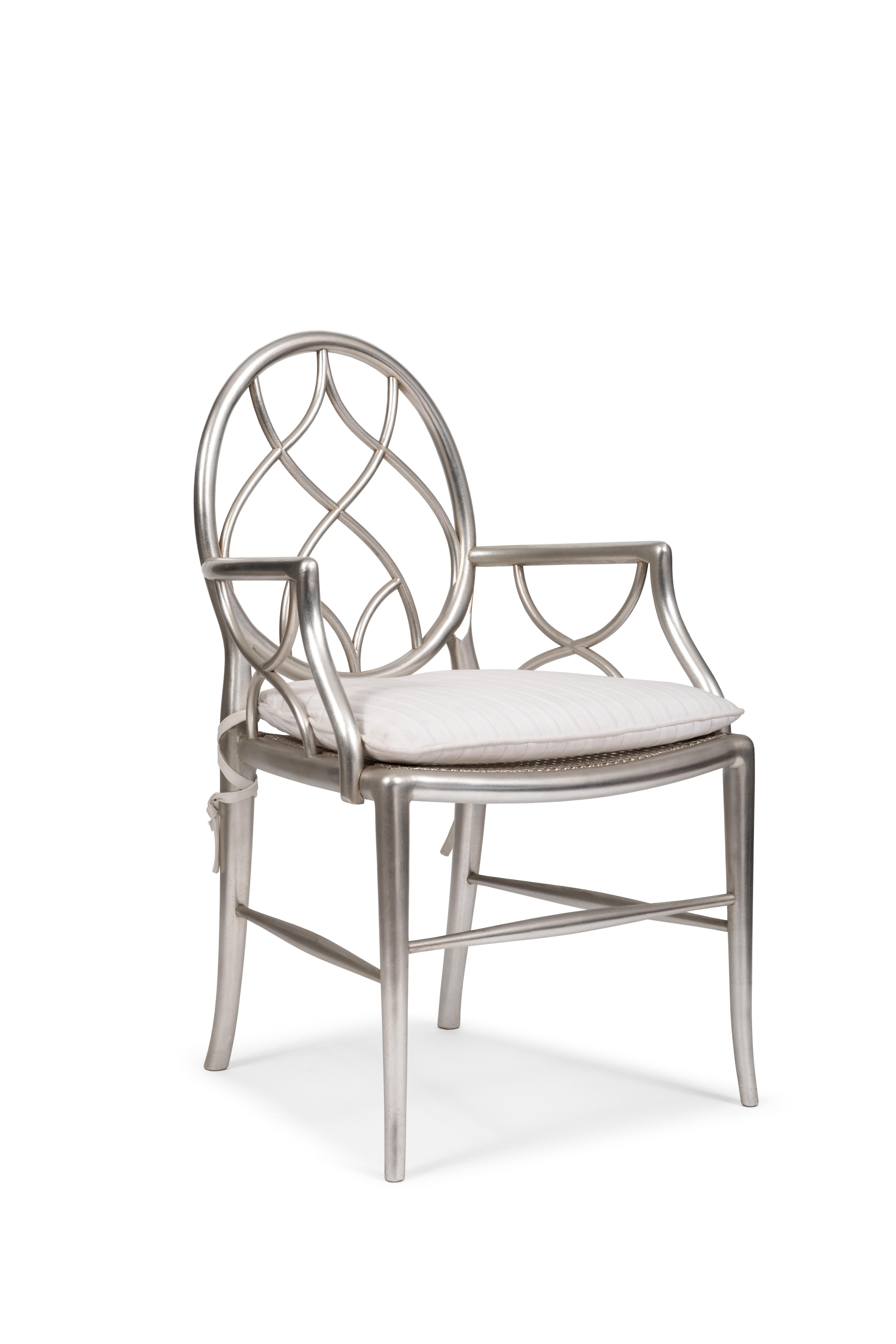 Decorative dining chair with armrests. This armchair was designed by Belloni in 1990 and included in its 