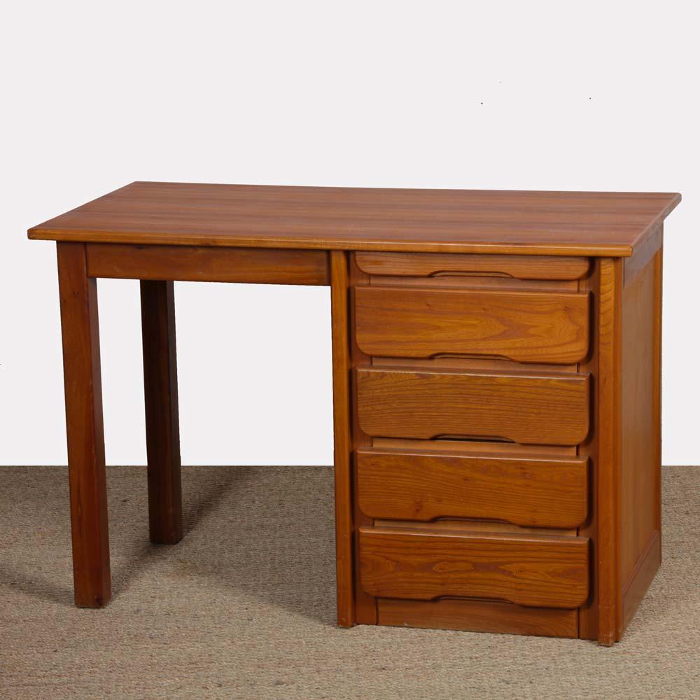This wooden desk was produced by Hafele in the 1980s. It opens with a series of four drawers on the right. The structure is in elm. This desk is in good vintage condition. The top is restored.