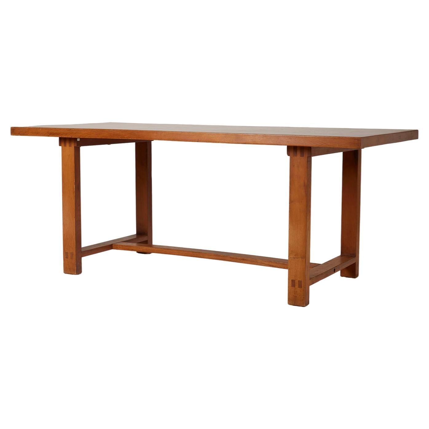 Wooden dining table by Pierre Chapo