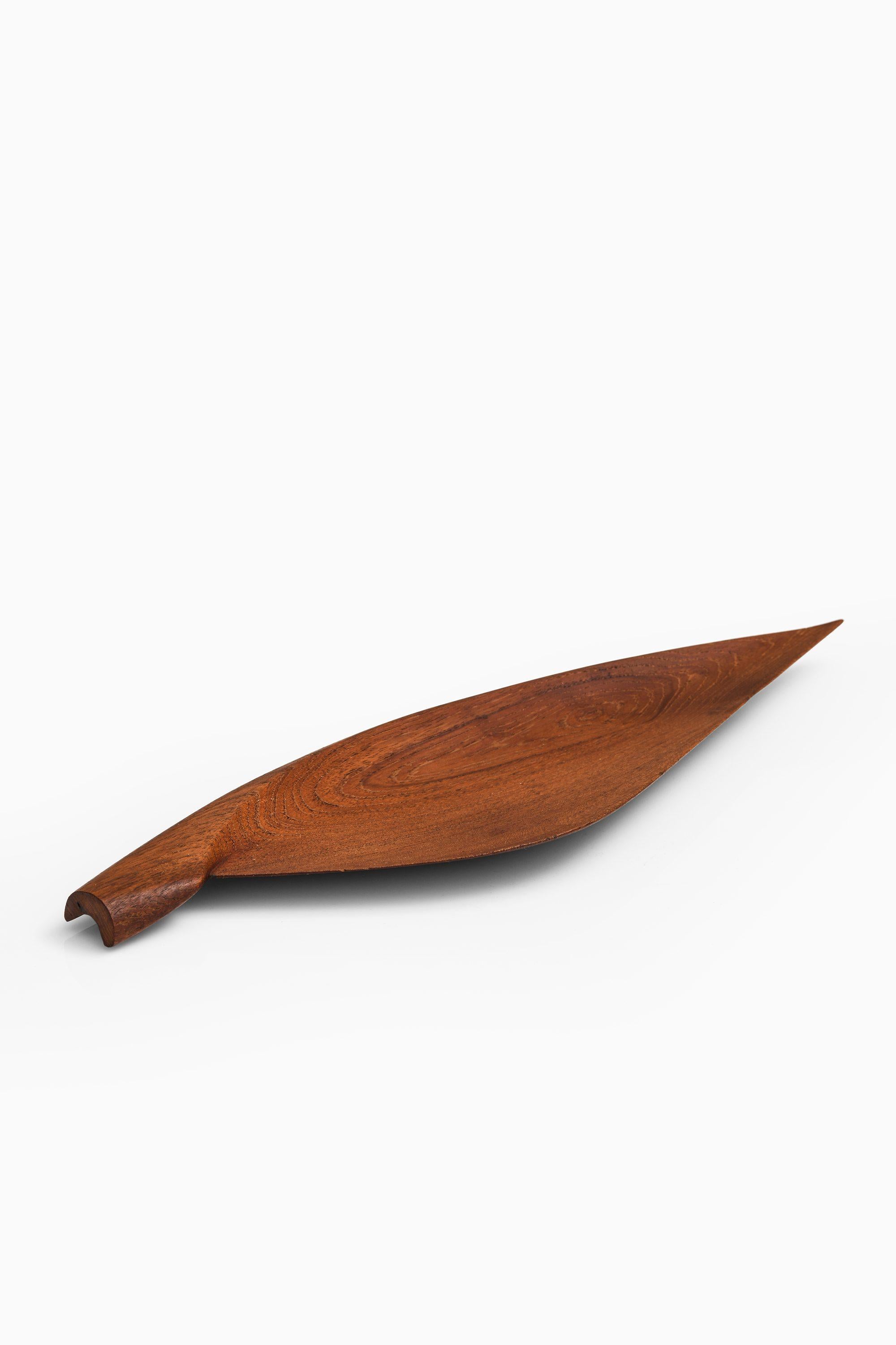 Wooden Dish in Teak by Yngve Ekström, 1950s

Additional Information:
Material: Wood
Style: Scandinavian, Mid century
Produced in Sweden
Dimensions: (W x D x H): 54.5 x 16 x 2 cm
Condition: Good vintage condition, with small signs of usage