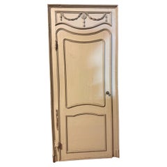 Antique Wooden door with one leaf with wavy panel, beige lacquered with frame, Italy