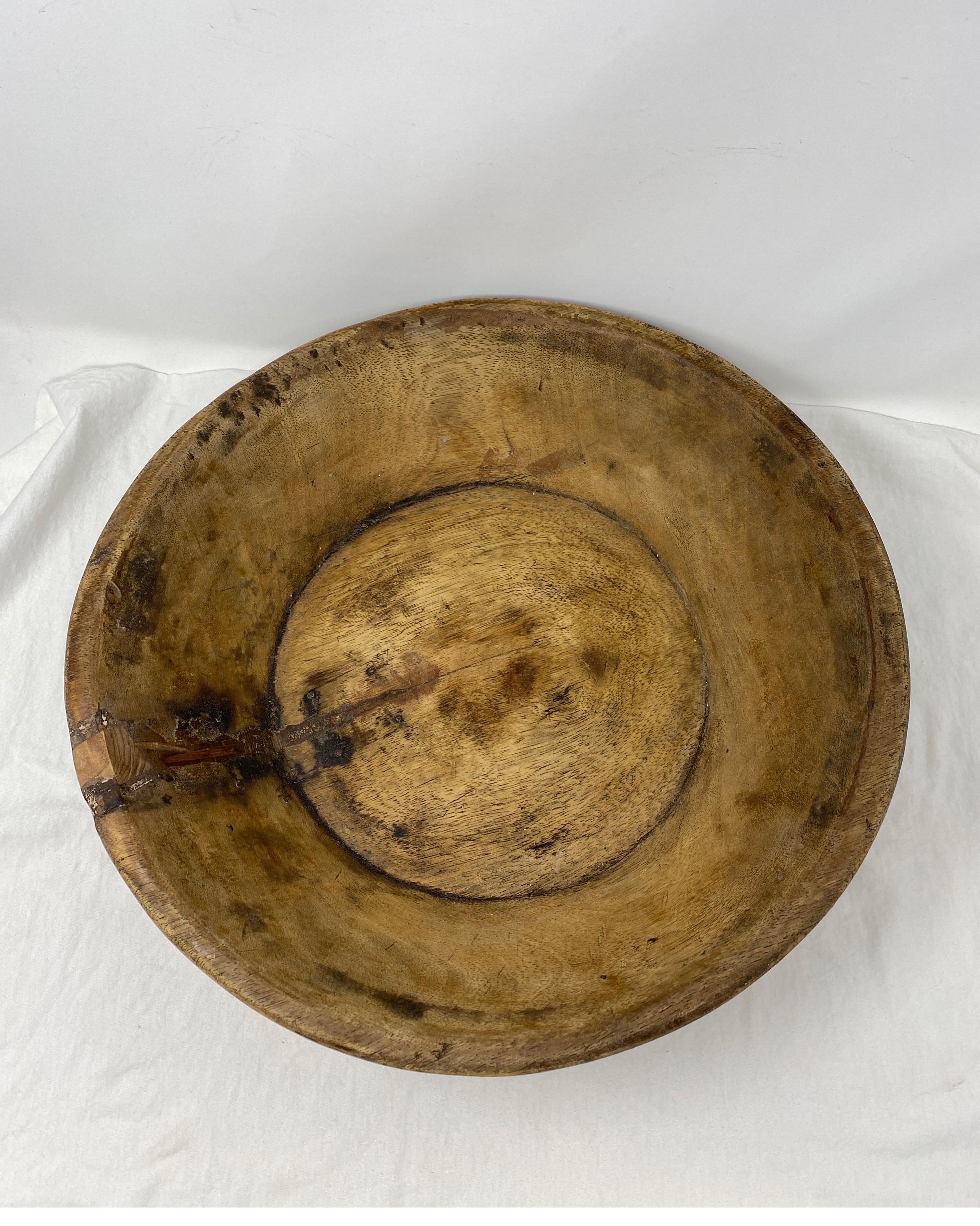 Wooden dough kneading parat bowl original old hand carved hard wood.

A old wooden round bowl originally used for kneading dough in olden times. Hand carved in a nice shape in a single block of hard wood. The bowls are very tactile and can be used