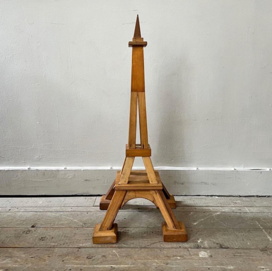 Scratch built wooden Eiffel Tower architectural model. Strong, simple lines and beautiful honey toned wood give the piece excellent presence. 

France, circa 1950

Dimensions: 34H x 14.5D.