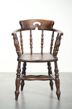 Wooden English antique pub/captain chair from the late 19th century