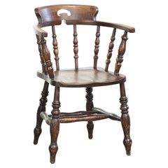 Wooden English antique pub/captain chair from the late 19th century