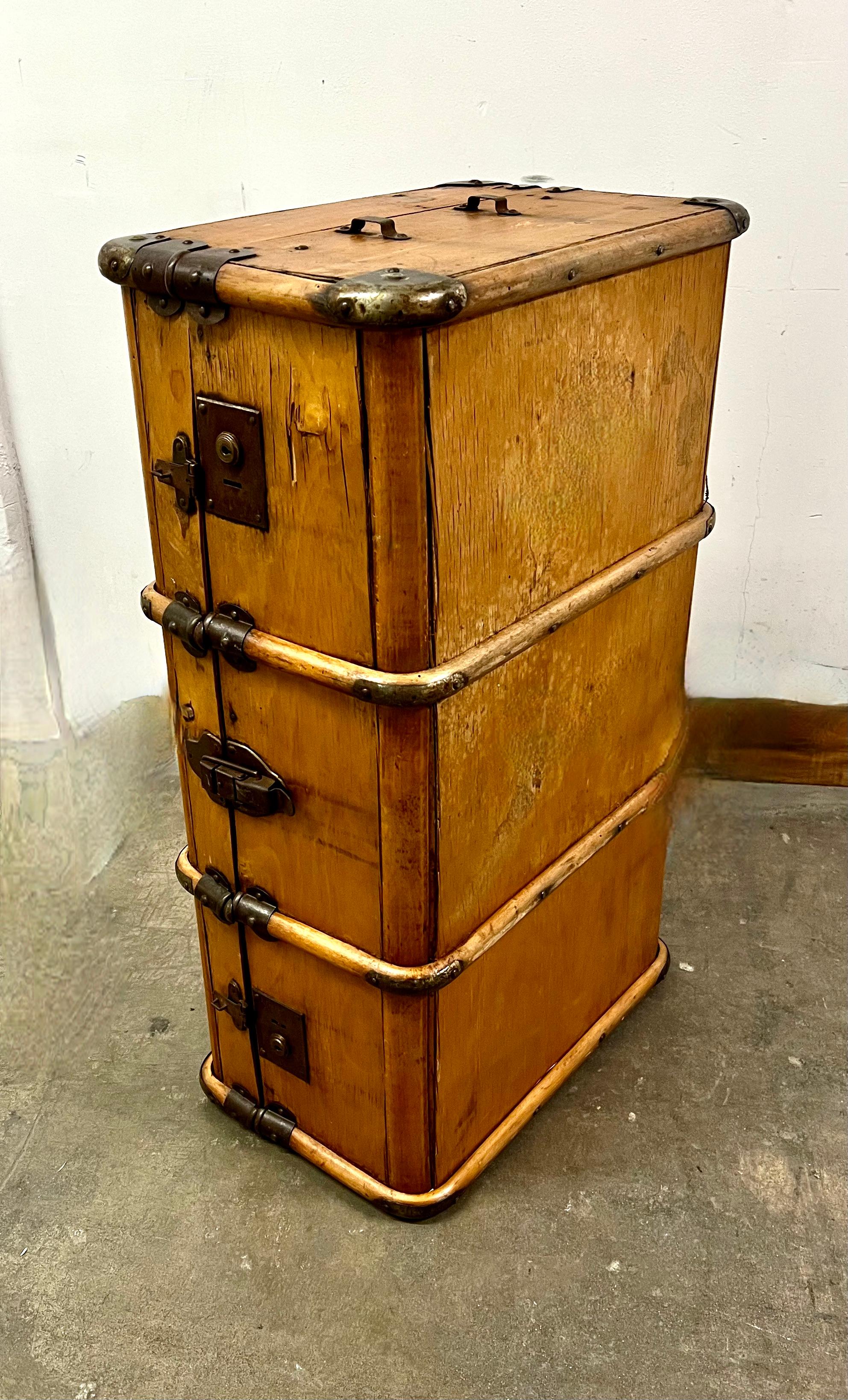 An original piece of wooden luggage with wooden supports and brass fittings and closures. the piece has a remarkable patina and is in fairly good condition for it's age. A wonderful decorative piece in the style of Ralph Lauren.

The piece does