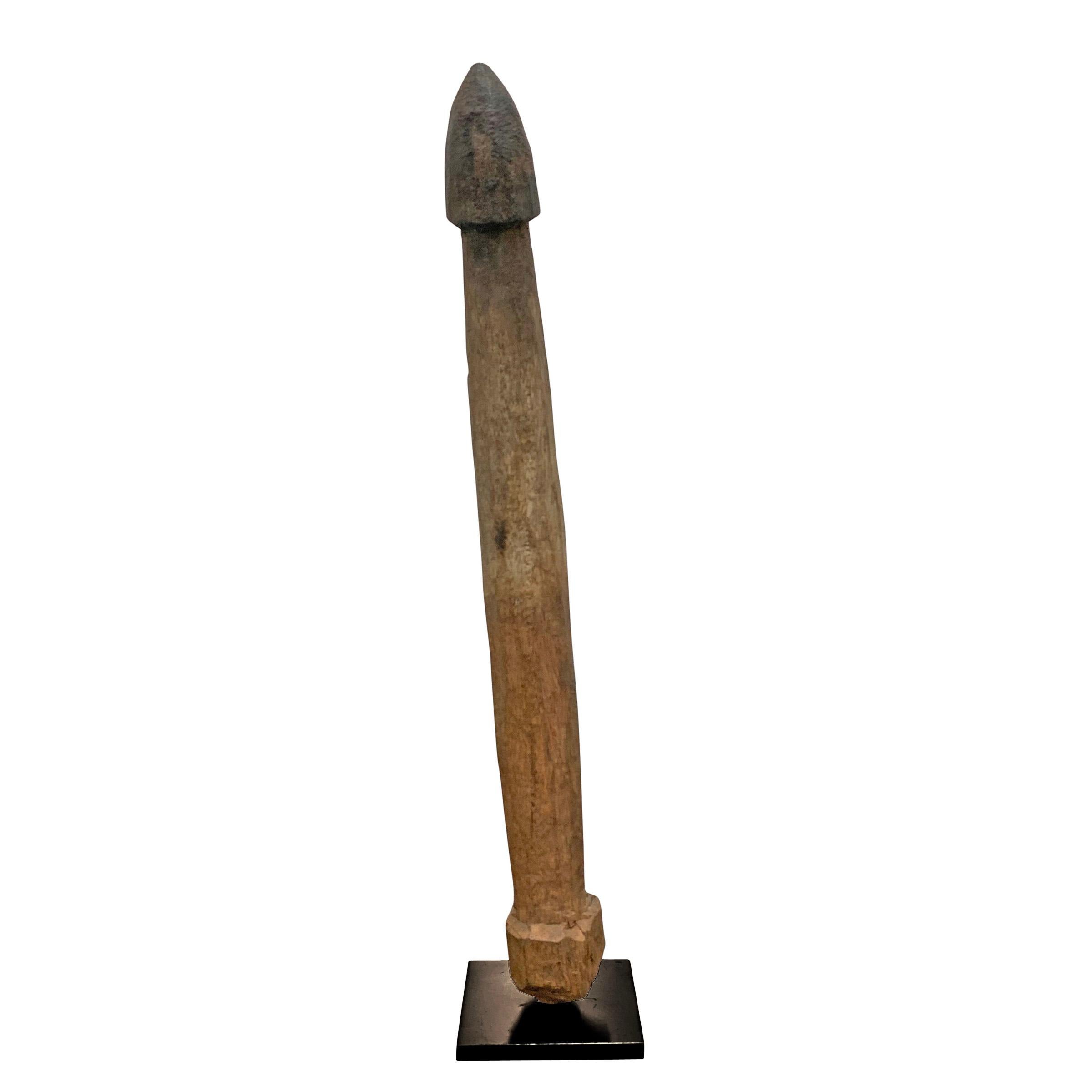 A wonderful early 20th century Fon wooden phallus fertility figure mounted on custom steel stand. Phallus figures like these were placed into the dirt of a farmer's field as an offering for a fertile and abundant crop. This piece shows lots of wear