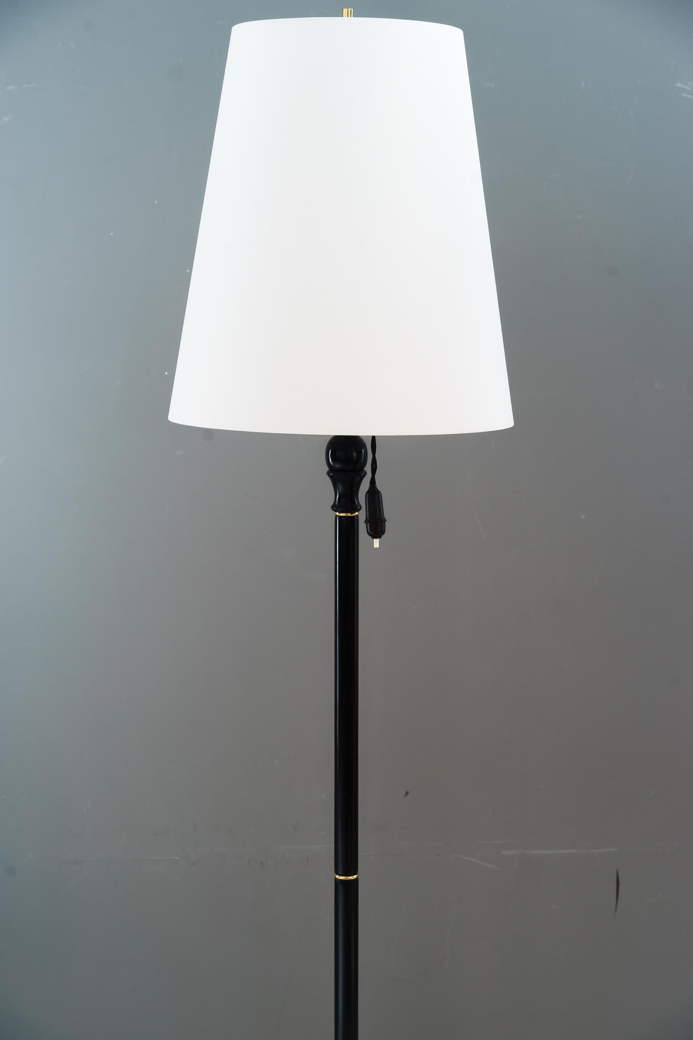 Wooden floor lamp vienna around 1960s
Brass parts polished and lacquered 
The shade is replaced ( new )
