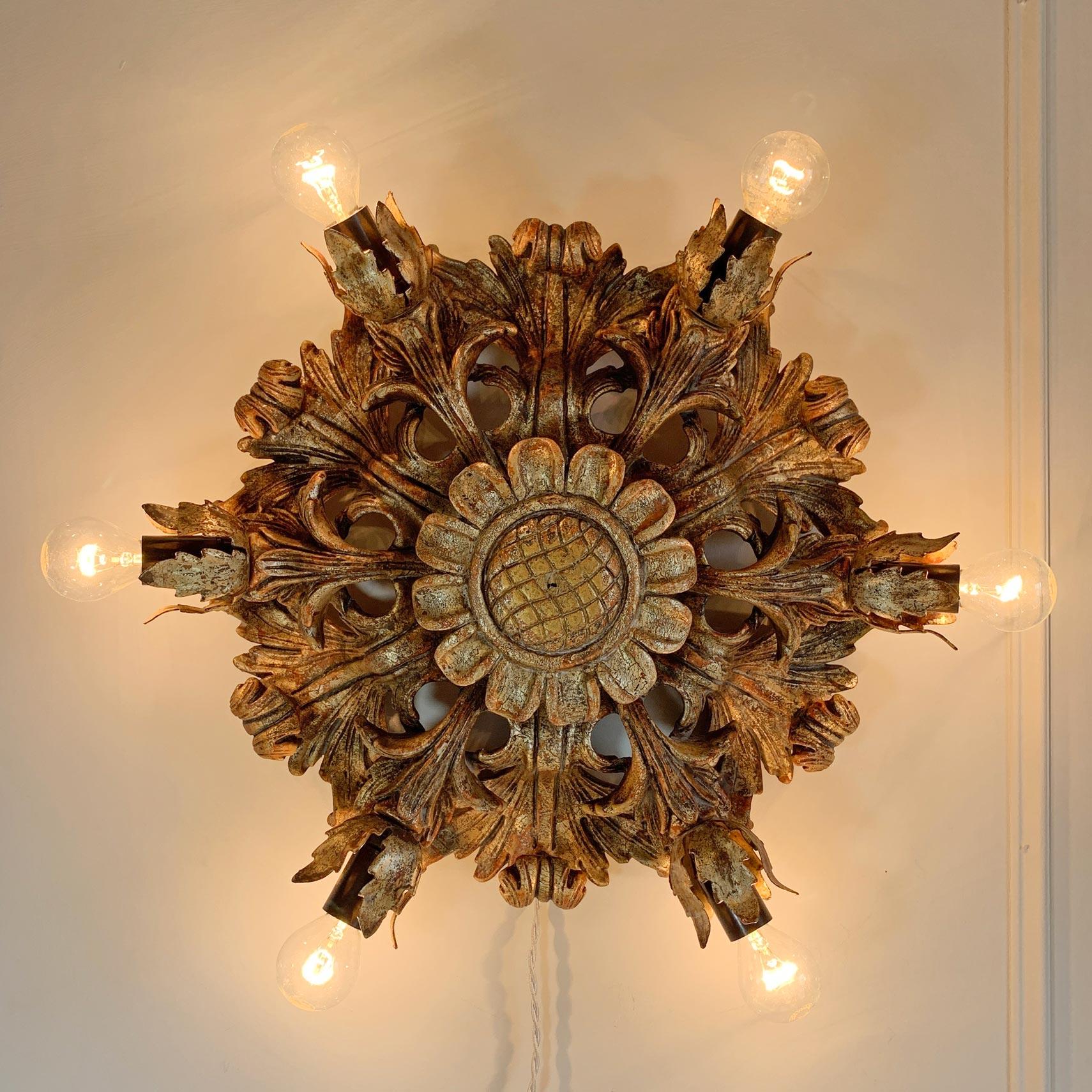 An outstanding giltwood ceiling flush light, hand carved in the form of leaves and flowers, with a large central sunflower. Designed and made by the CN Firenze Italian design house, the light dates to the mid 1970’s and features 6 lamp holders (e14