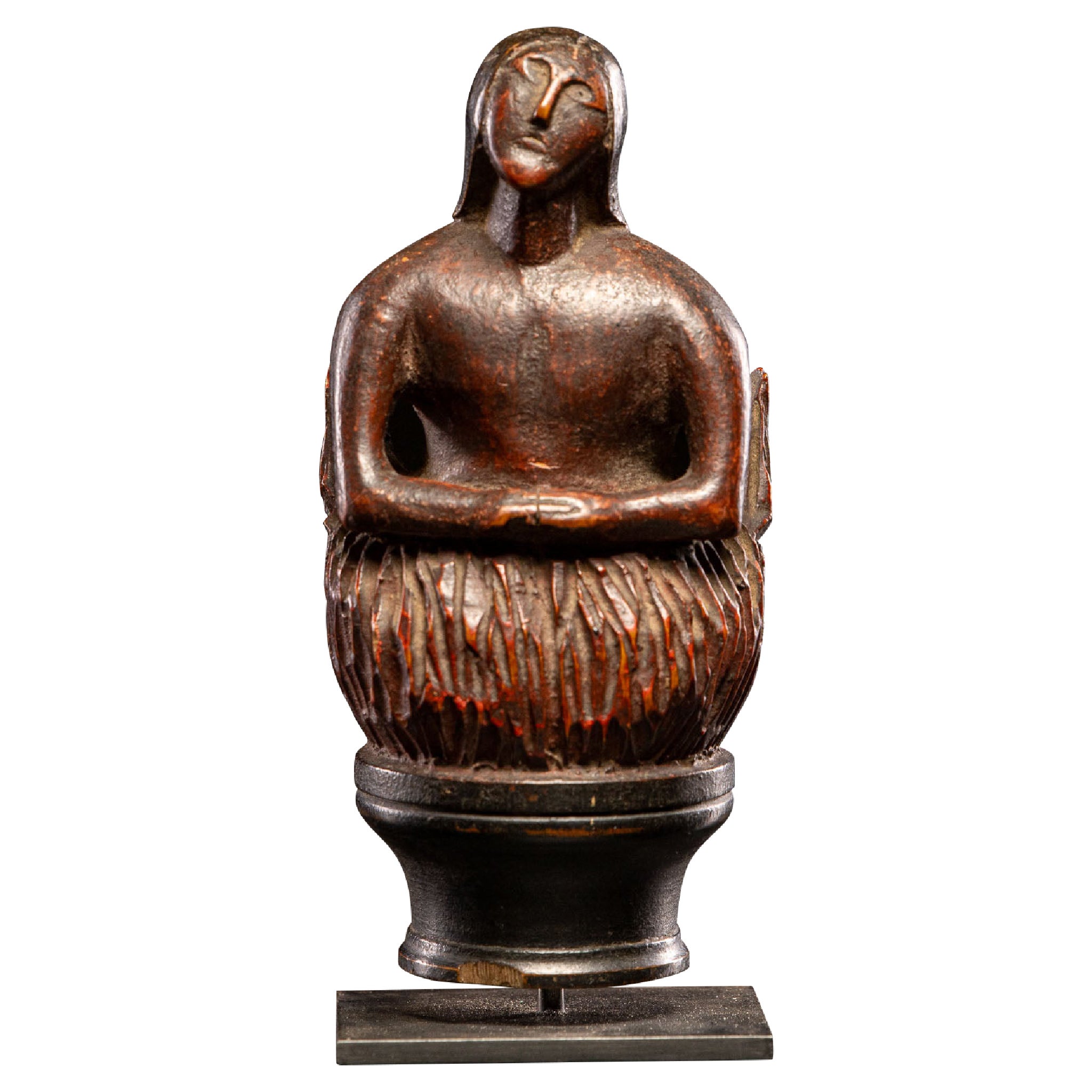 Wooden folk-art figure, depicting a stylized feminine Soul burning in Purgatory.