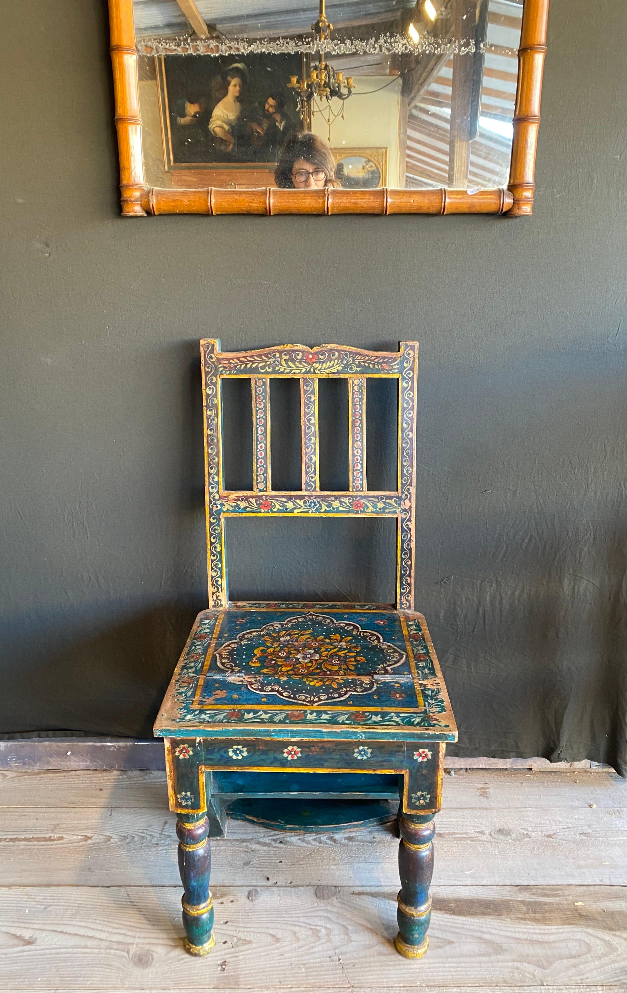 Delightful wooden hand painted chair 
It becomes a foot stool easily
Very good condition
Very Nice hand painted patterns 