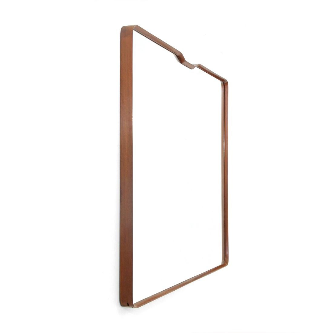 Italian manufacture mirror produced in the 1950s.
Solid wood frame with rounded corners.
Mirrored surface.
Good general conditions, some signs due to normal use over time.

Dimensions: Length 148 cm, depth 6 cm, height 121 cm.