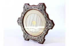 Wooden frame with silver shell applications and support