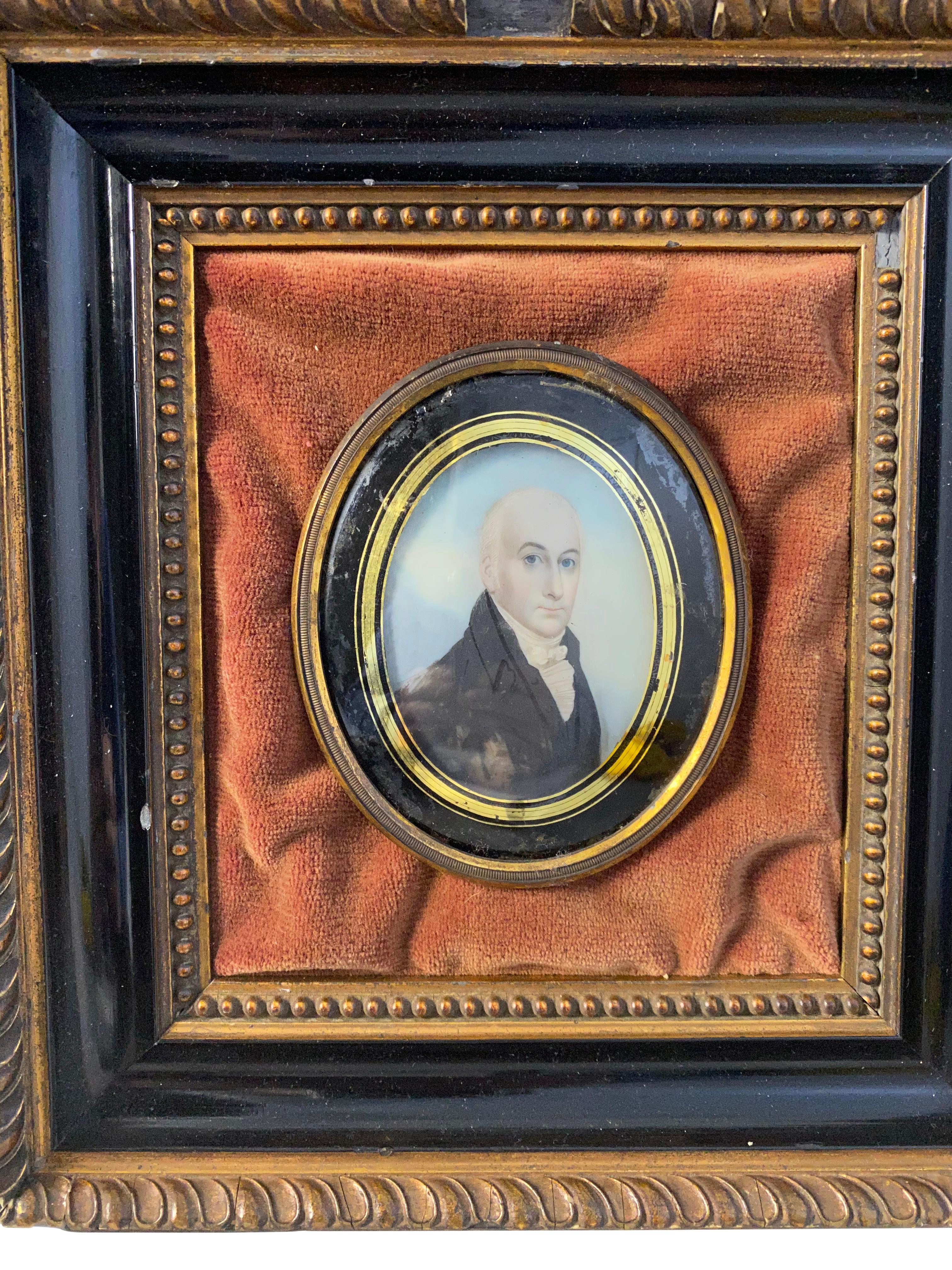 A miniature rustic framed oil on board painting of an English gentleman wearing a frock coat and stiff collar, a fashion common in Victorian England. Framed in a dome glass frame, 18th century. Unknown condition.

Dimensions (cm):
H 24, W 22, D 5.