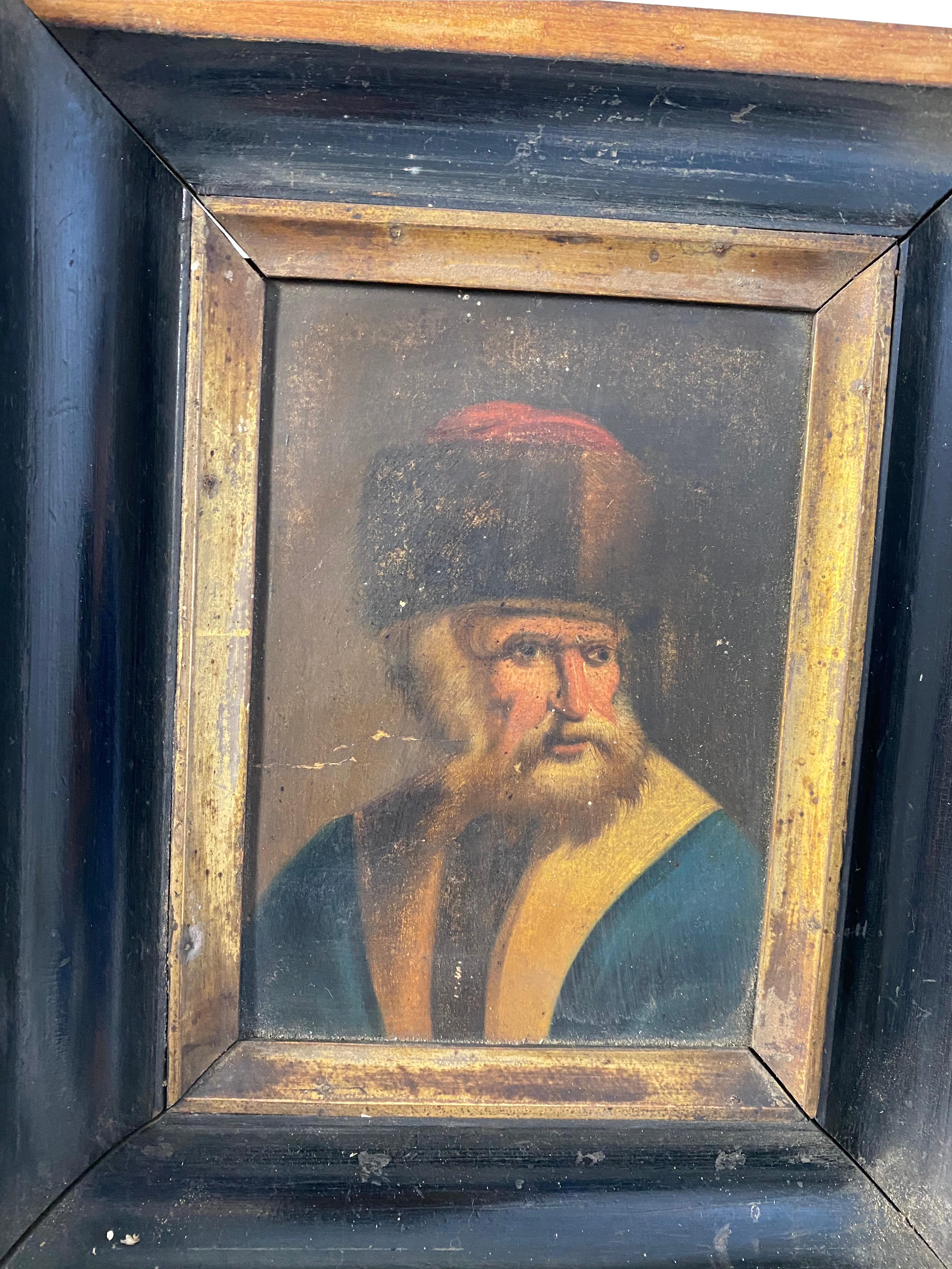 A rustic framed picture of what is likely a Rabbi posing for a portrait. There is a lighter colored wooden inner frame surrounding the picture adjacent to the darker wooden circumference frame. A great piece of history, 18th century. Unknown