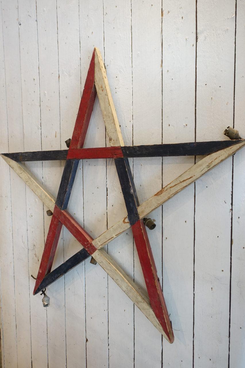 Vintage French wooden star frame, painted in the colors of the French flag. Provenance – Lyon, dated early 1900s, where they would be used for the annual Festival of Light. The Fête des Lumières is a town fête held on the 8th December, and is a