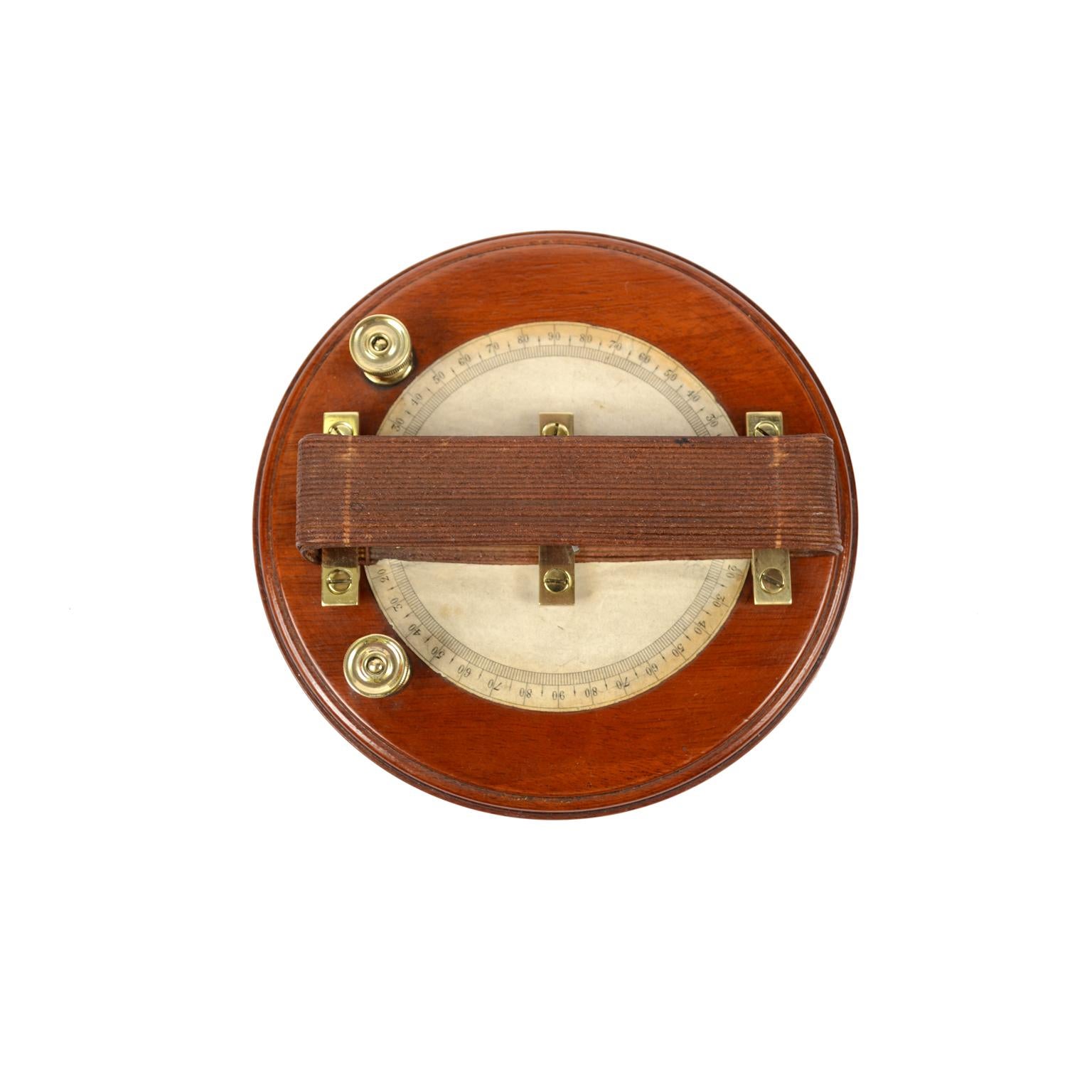 Astatic galvanometer by Elliott of the mid-19th century, mounted on a turned wooden base. It is an instrument used to measure weak currents. The instrument consists of a coil, a graduated scale placed under the circular coil, an astatic system