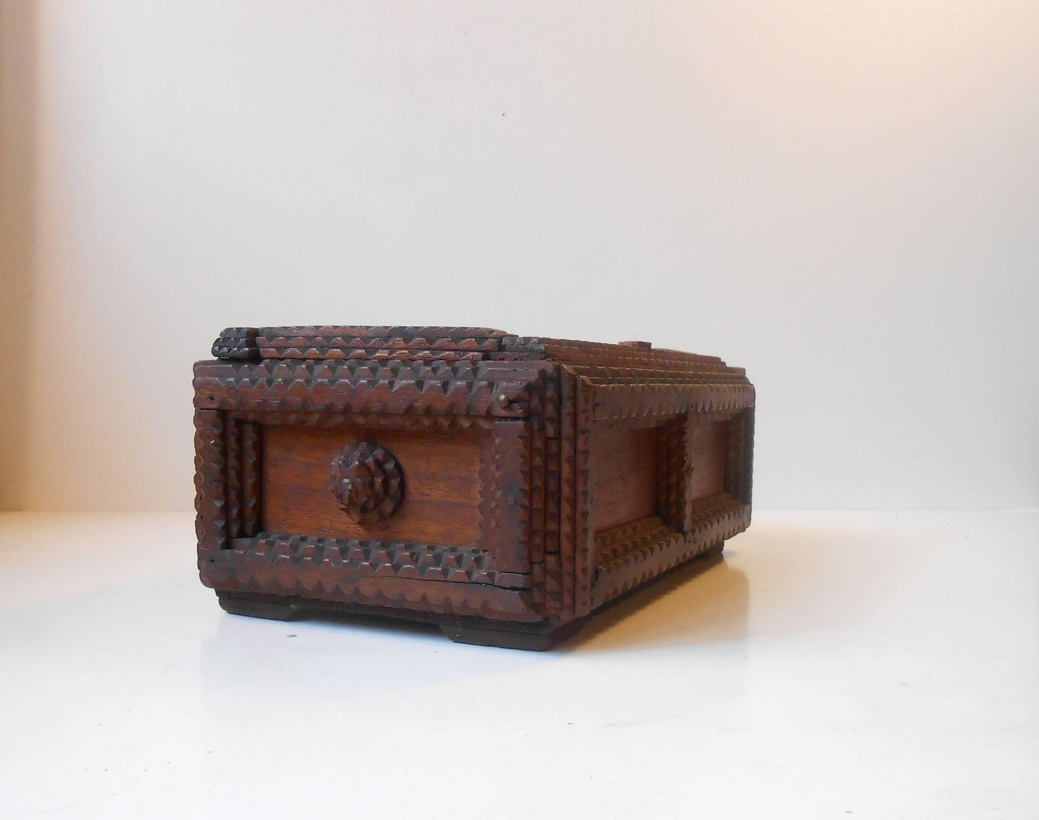 German Volk art box. Scaled down coffin. Hand carved with characteristic primitive detailing. Measurements: H 5 inches, W 10.25 inches, D 6.2 inches.