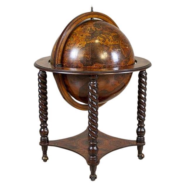 Wooden Globe-Shaped Liquor Cabinet From the Mid. 20th Century

Richly adorned and elegantly designed, a closed liquor cabinet in the form of a globe, standing on four turned wooden legs, finished with wheels.