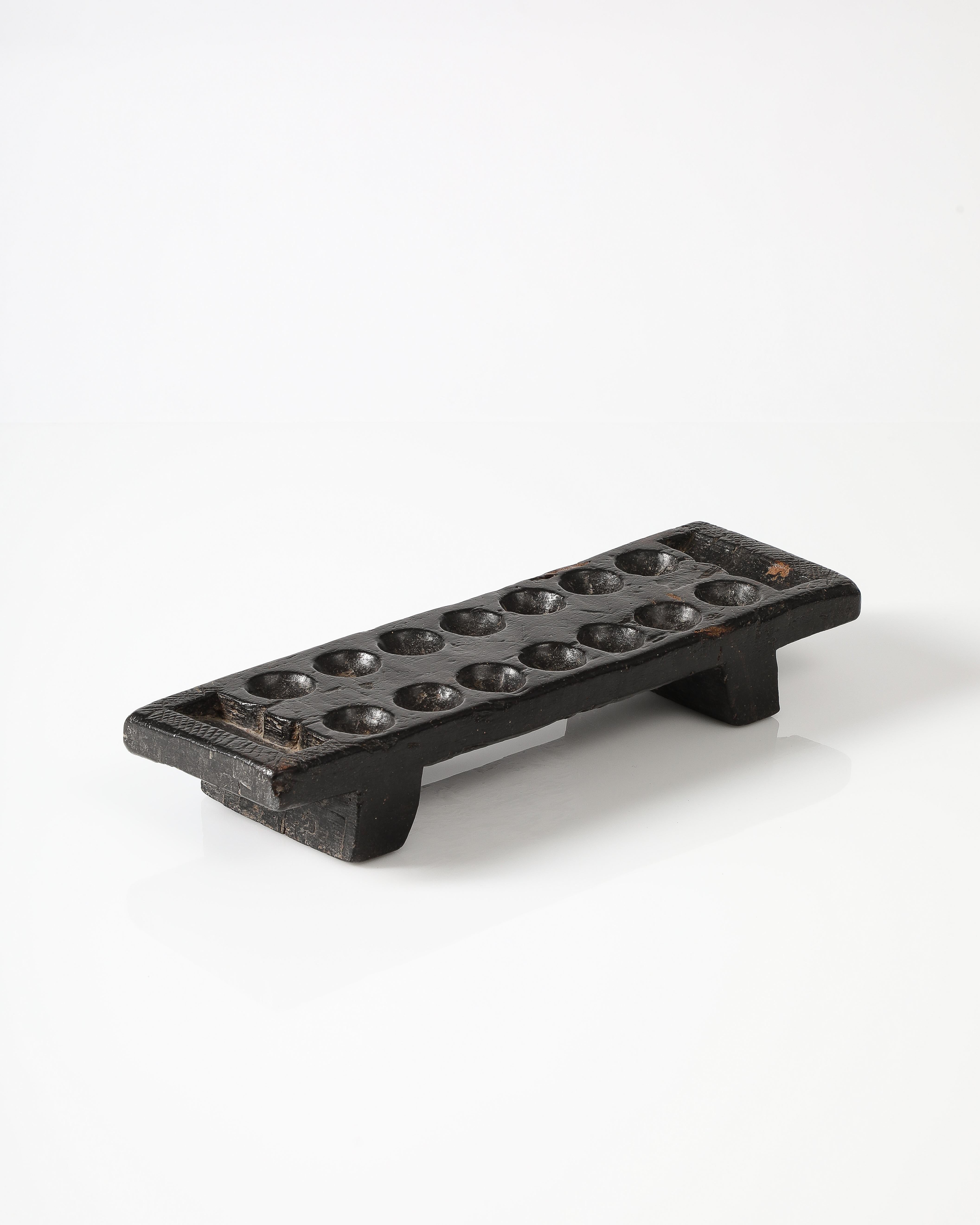 Unique, hand-carved mancala board.