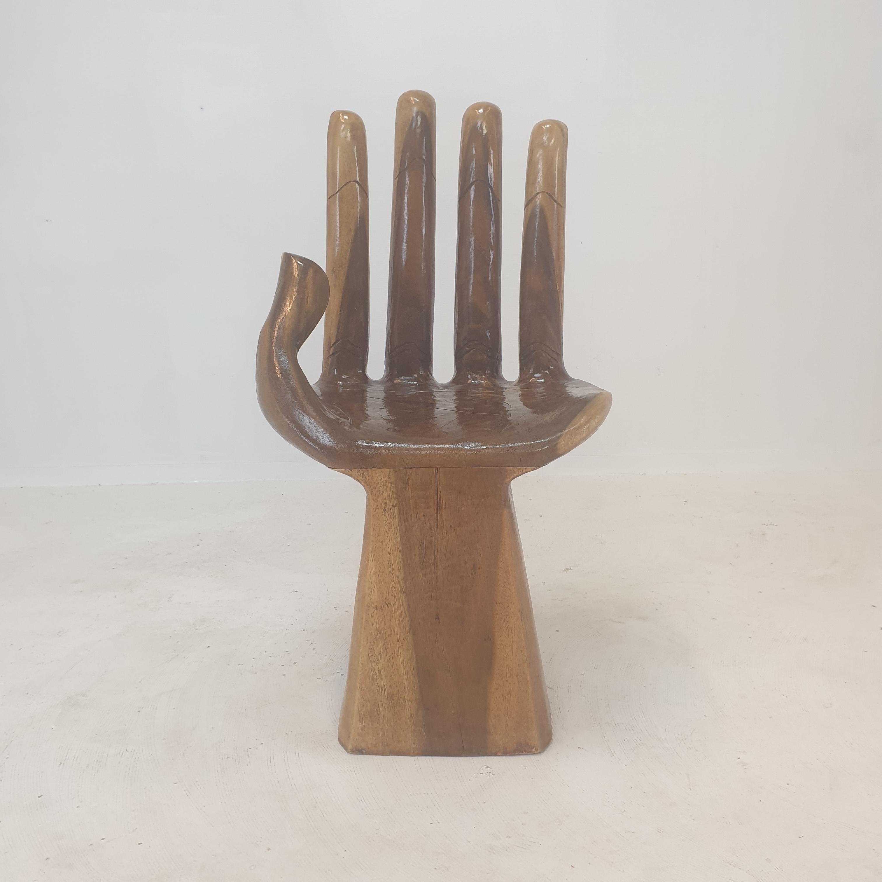 Beautiful wooden carved hand chair.
Objet d'art after the iconic Pedro Friedeberg Hand Chair. 

This interesting piece would make a wonderful sculptural decoration, and/or conversation piece. 

Natural carved wood so there may be cracks to the wood