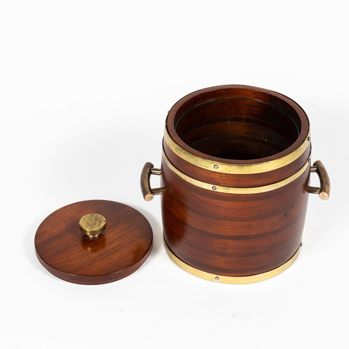 Wooden ice bucket with brass fittings from England circa 1920.