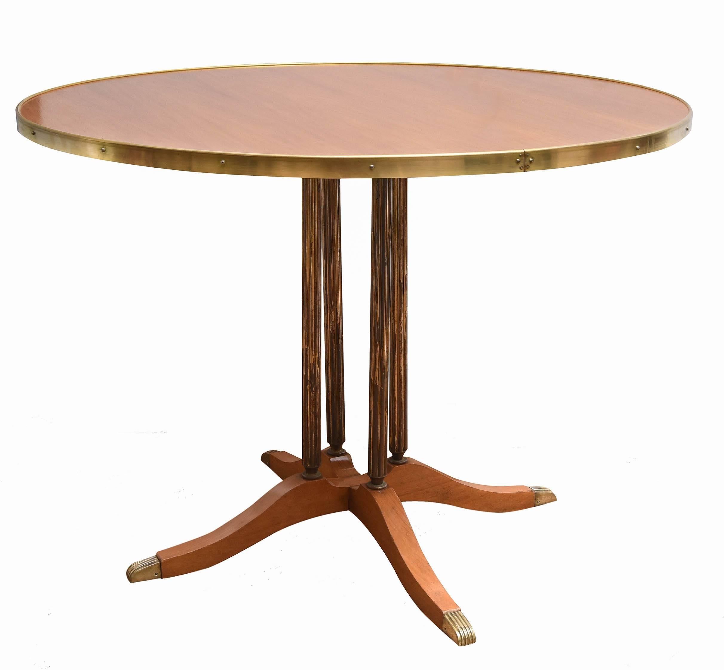 Round table with brass columns.