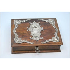 Wooden jewelry box with silver applications and key