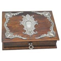 Wooden jewelry box with silver applications and key