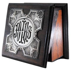 Wooden jewelry box with silver décor and “jewels” inside, pink velvet lining