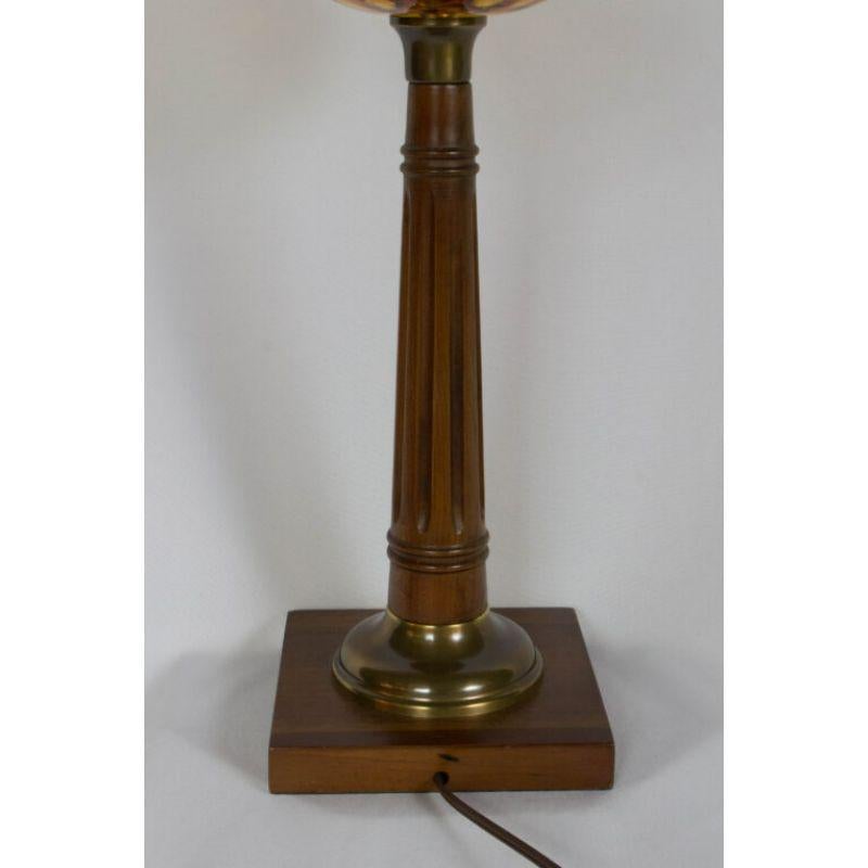 Wooden Lamp with Amber Glass Font. Completely restored and rewired with new socket and harp. American, C. 1950

Dimensions
Width: 6″
Depth: 6″
Height: 21″