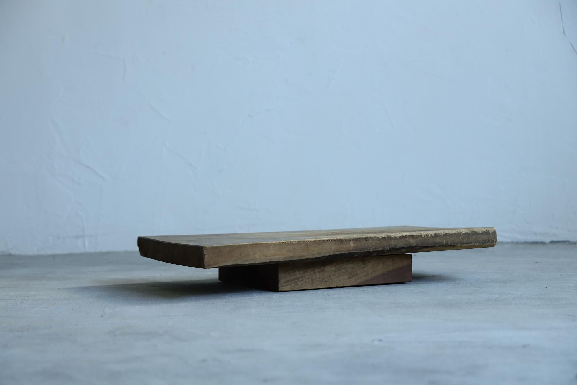 Introducing our one-of-a-kind low table, a beautiful blend of history and craftsmanship. The tabletop is crafted from exquisite cherry wood, once a sewing table from Japan's Taisho era. The base, originally a Go board used for Shogi, adds a unique