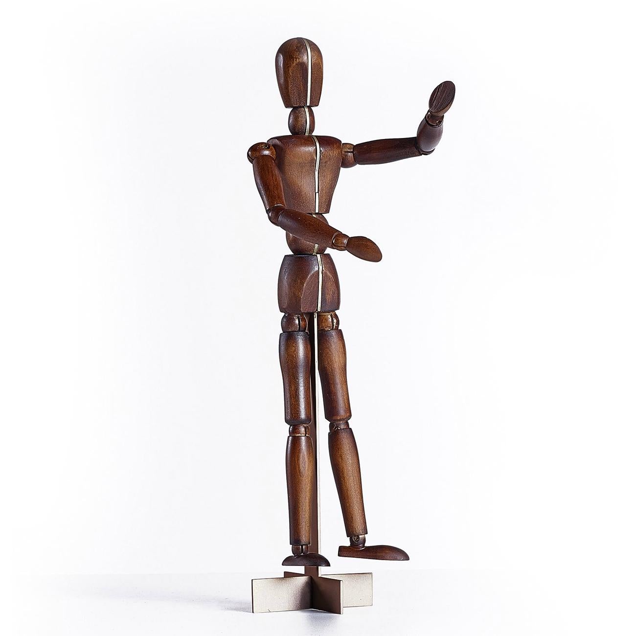 Sculpture wooden man with sold ash wood in
walnut stained finish and with structure in solid 
brass in matte finish.