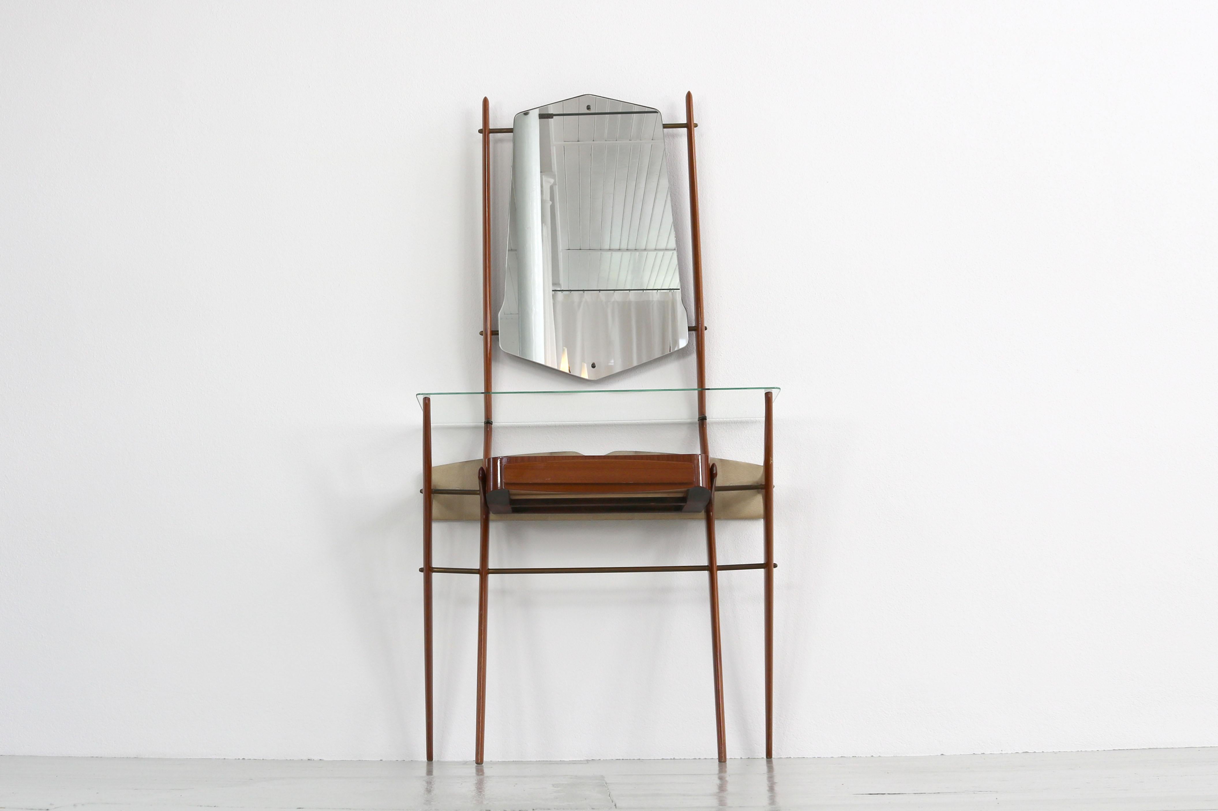 Beautiful console with a mirror from Italy, 1950s. The wooden frame carries an elongated hexagonal mirror and a narrow glass shelf.
 