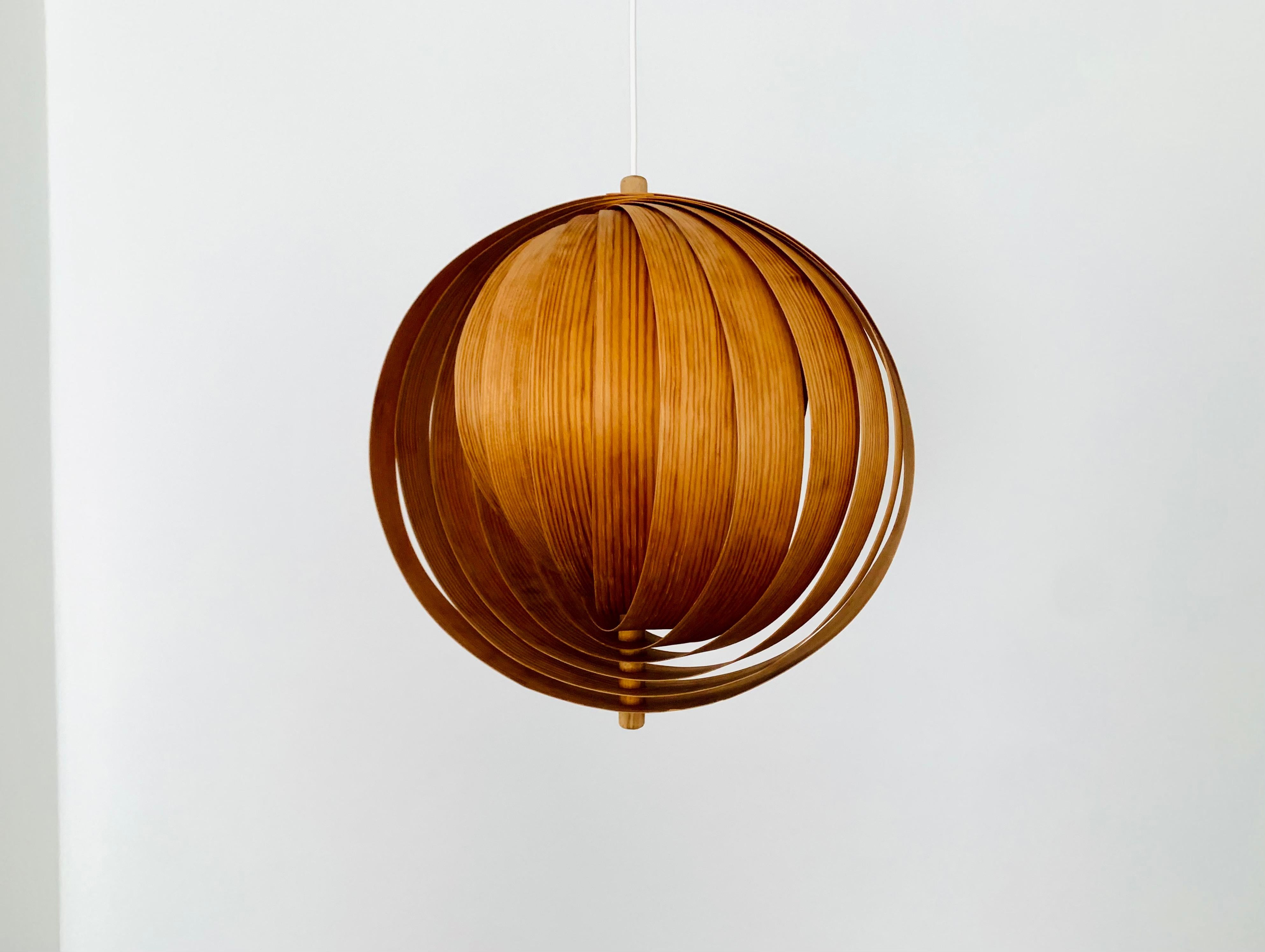 Extraordinarily beautiful wooden pendant lamp from the 1960s.
Loving and high-quality processing.
The design and the material create a very warm and pleasant light.

Condition:

Very good vintage condition with minimal signs of wear consistent