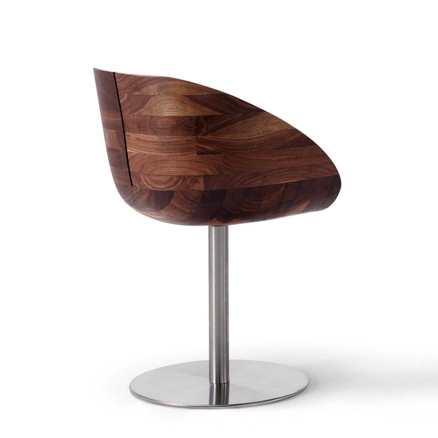 Chair wooden nest in solid walnut wood,
seat and back all in glued and modelled
solid walnut parts to create the nest shape.
On swivel base in steel in satinated finish.
Also available in elm or oak or cherry or maple.
 