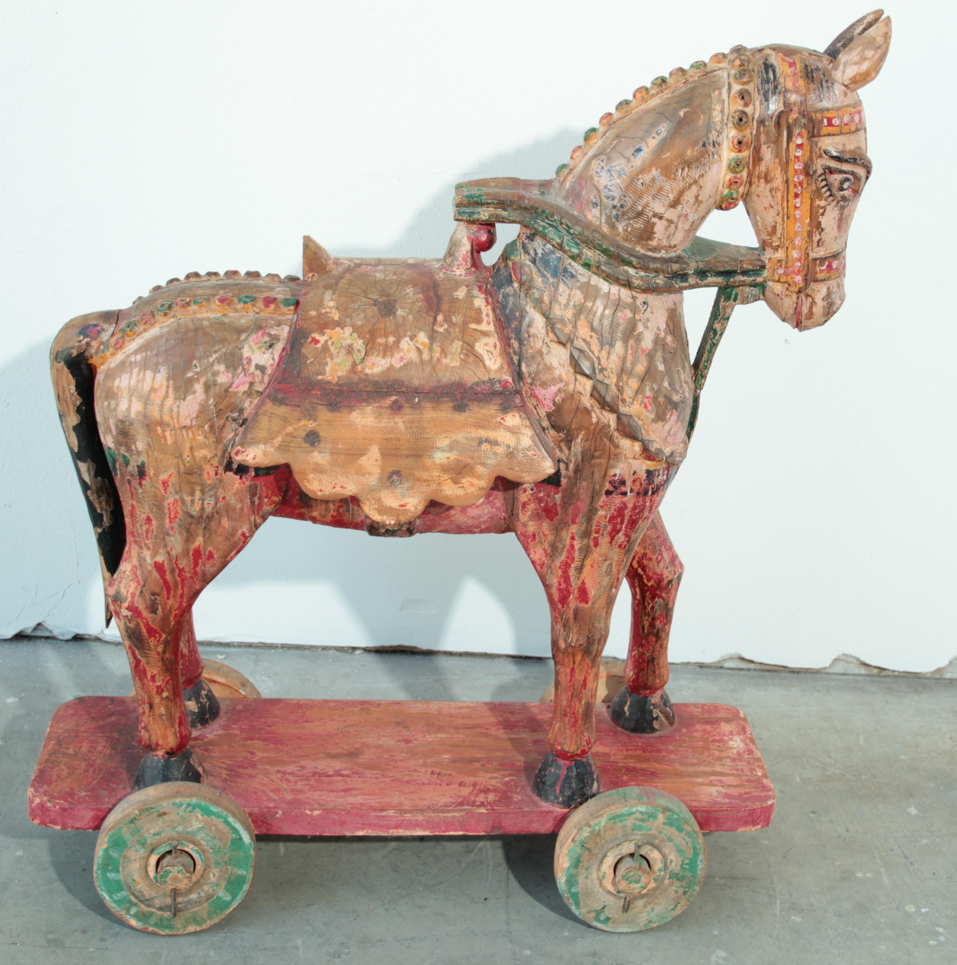 Antique Southeast Asian Polychrome Wooden Oversized Temple Horse from India.
Large Antique Southeast Asian Carved Polychrome Wood Horses.
Antique Southeast Asian carved wood model of a parade horse.
the body with allover polychrome, saddle and reins