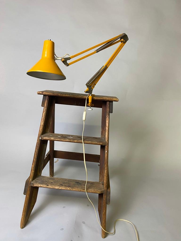 Industrial wooden painters ladder, 1930, from Amsterdam. This wooden ladder has it's original tag from the manufacturer Hendrik. A. van Waveren Ladderfabriek (ladder factory) Amsterdam. The ladder has paint splatters or stains still on it what makes
