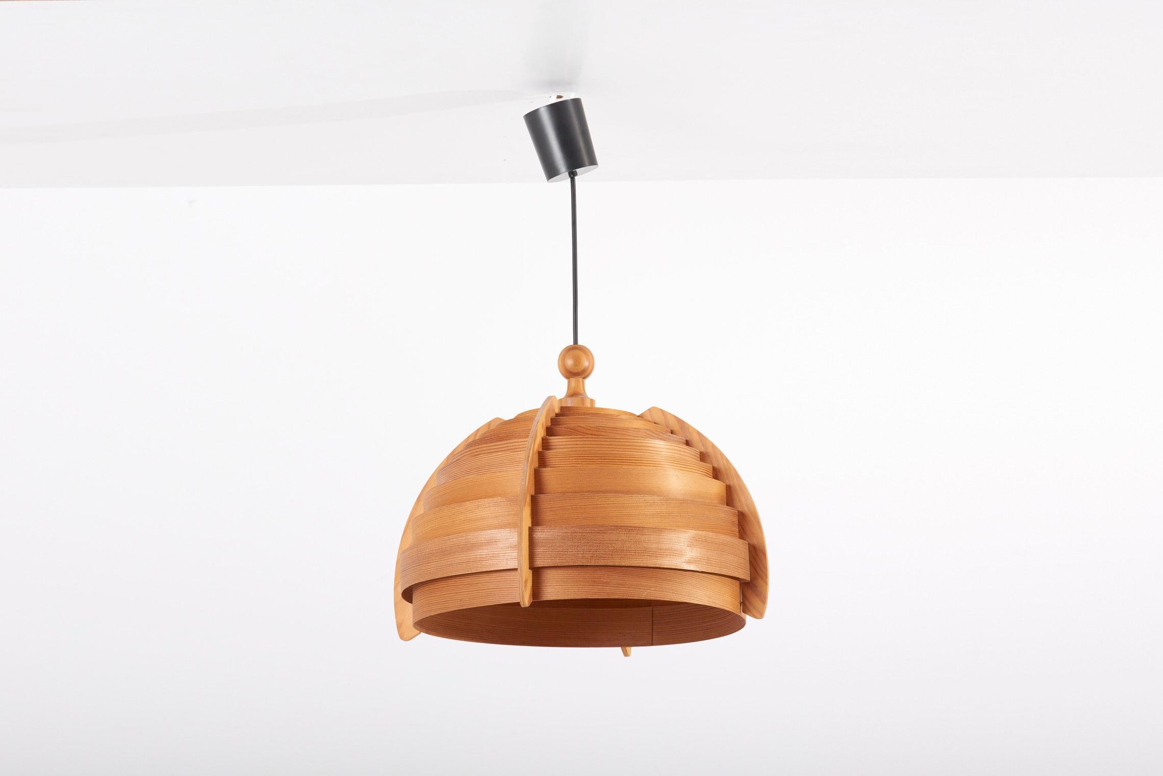 Wooden pendant lamp, designed in 1960s by Hans-Agne Jakobsson and manufactured by AB Ellysett Markaryd in Sweden.

2 x E27 socket.

Please note: Lamp should be fitted professionally in accordance to local requirements.