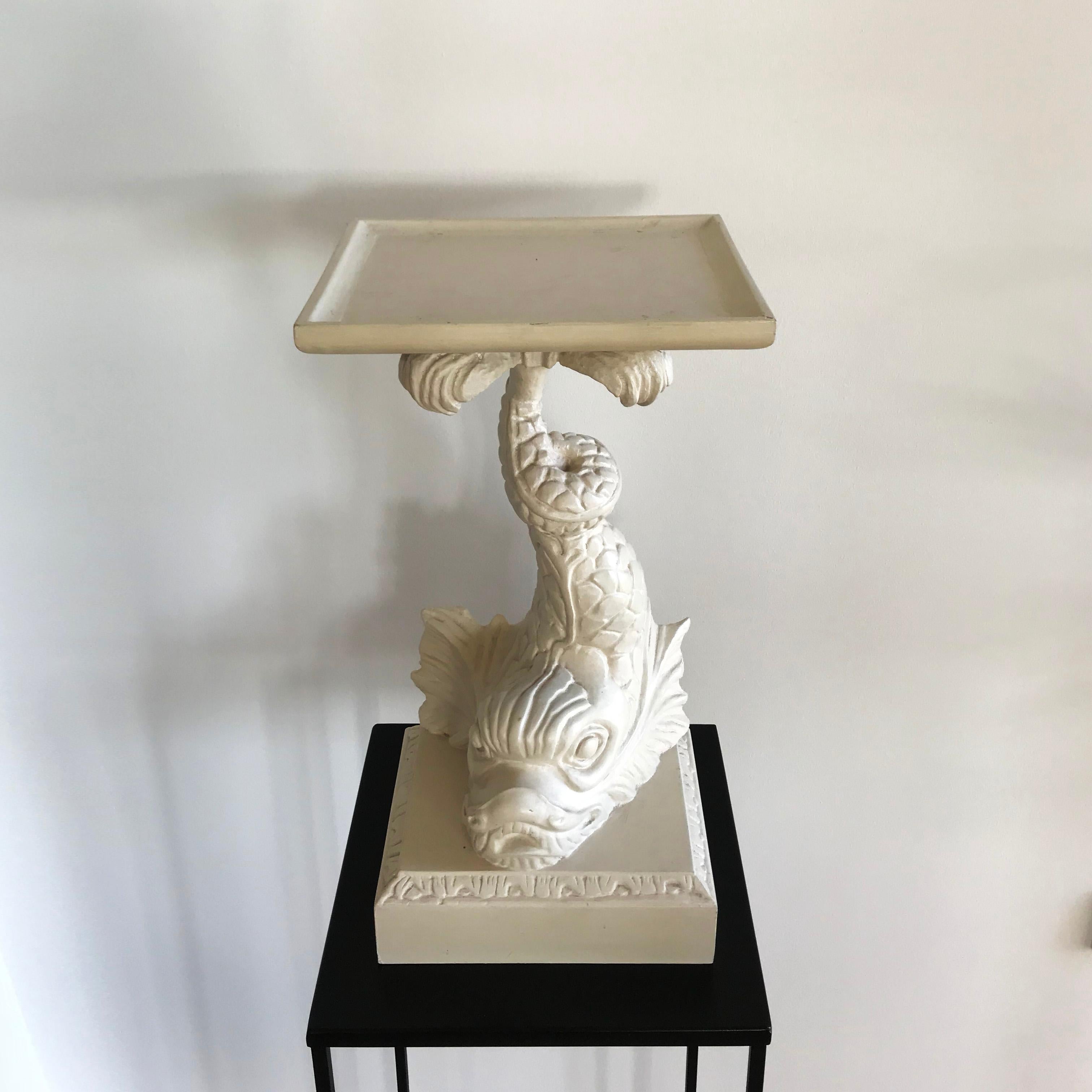 A decorous white painted Italian hand curved plant stand or low side table in the form of koi fish. This piece sits perfectly next to the wall and it can either described as koi fish or Japanese dolphin.
  