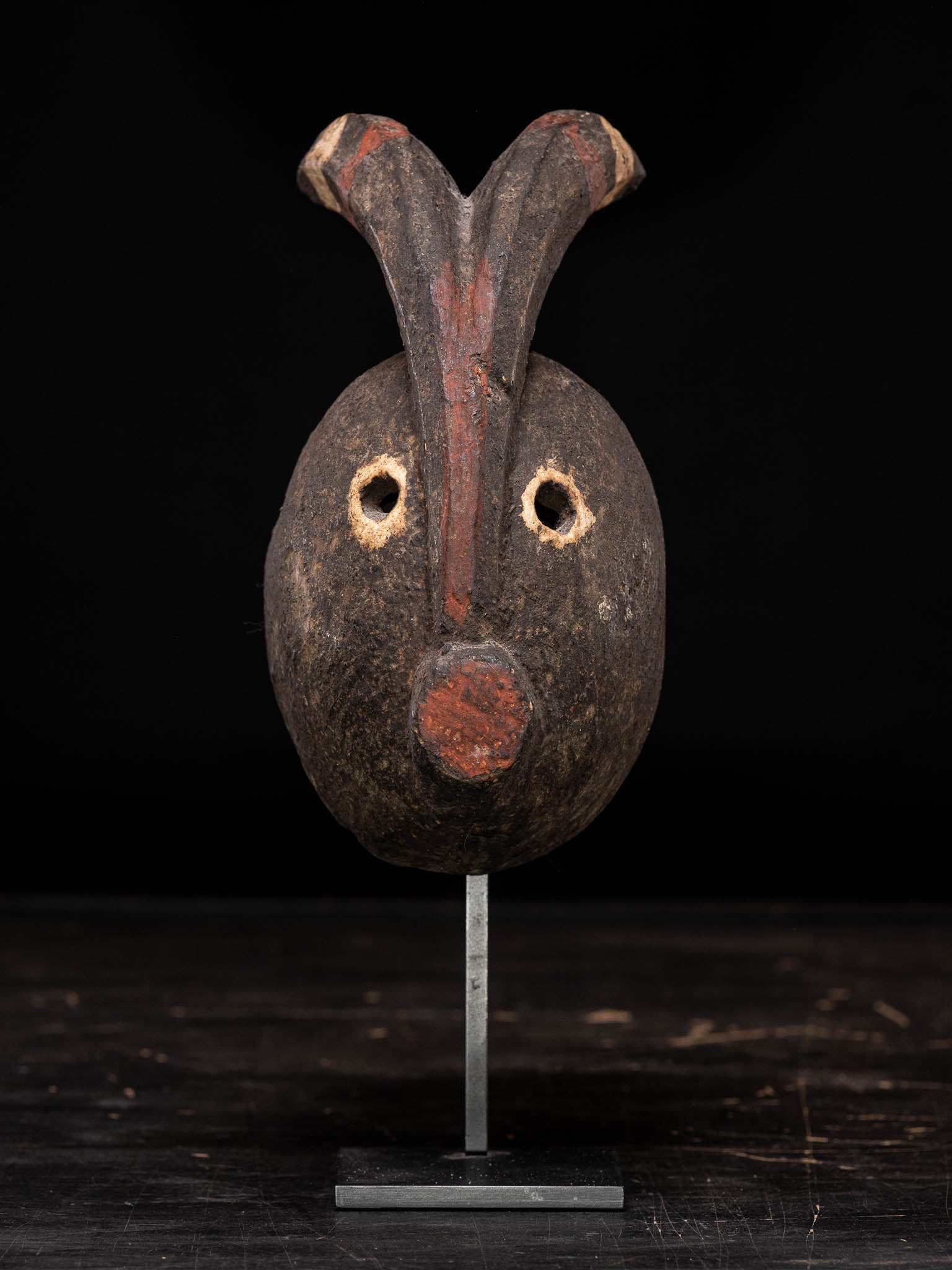 Ogoni Karikpo polychromed Dance Mask ,Ogoni Peopme, Nigeria.

Provenance:Lefevre 1995

This powerful Ogoni mask features an oval face ,pierced circular eyes, a the cylindrical mouth and a tall median ridge, surmounted by curved horns.The whole
