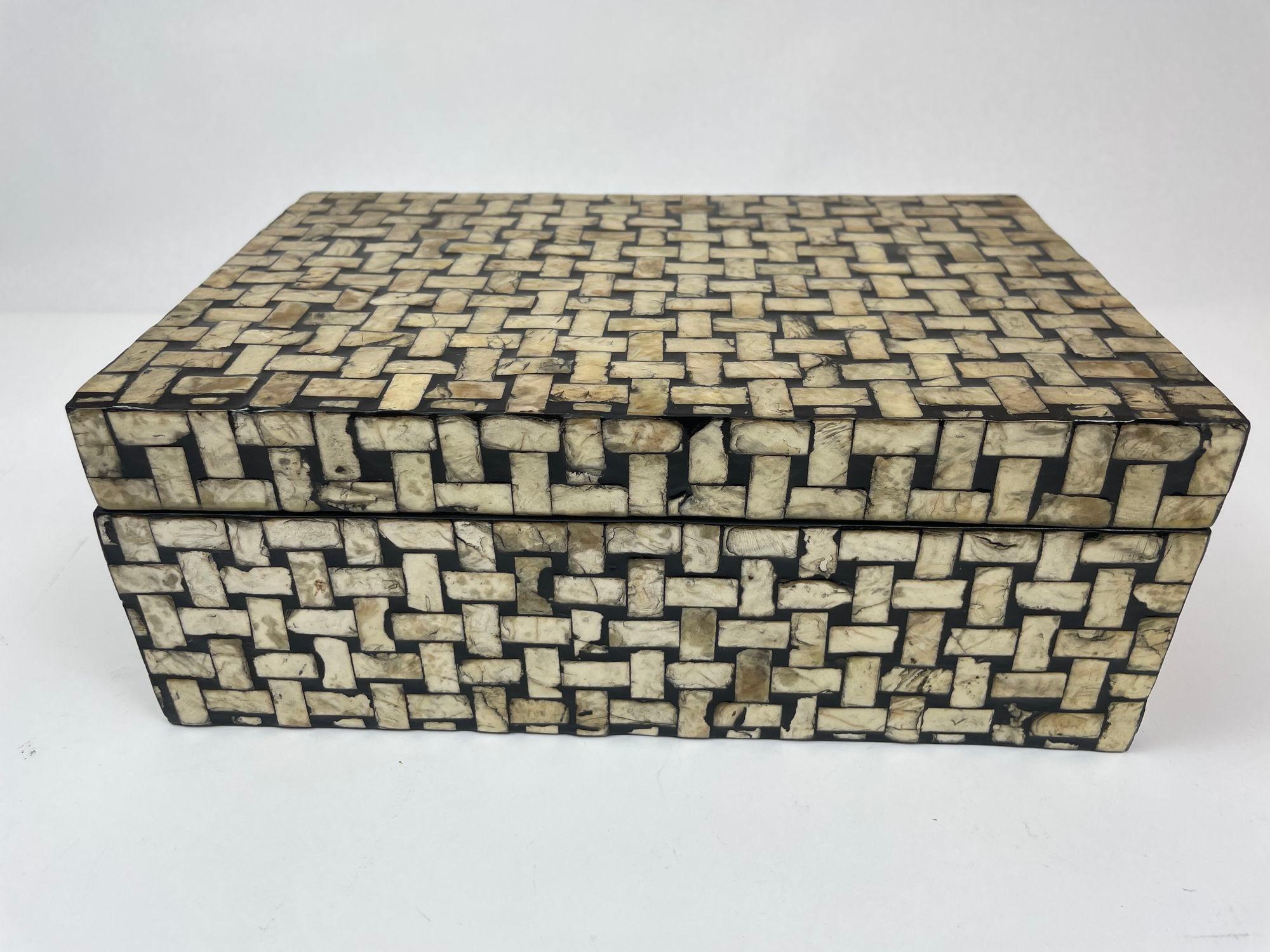 Wooden Rectangle Box Covered in Abalone Shell and black resin.
Mosaic tessellated shell mother of pearl decorative jewellery or trinket decorative box.
Dimensions: Height: 4.5 in Width: 11.5 in Depth: 7.5 in.
