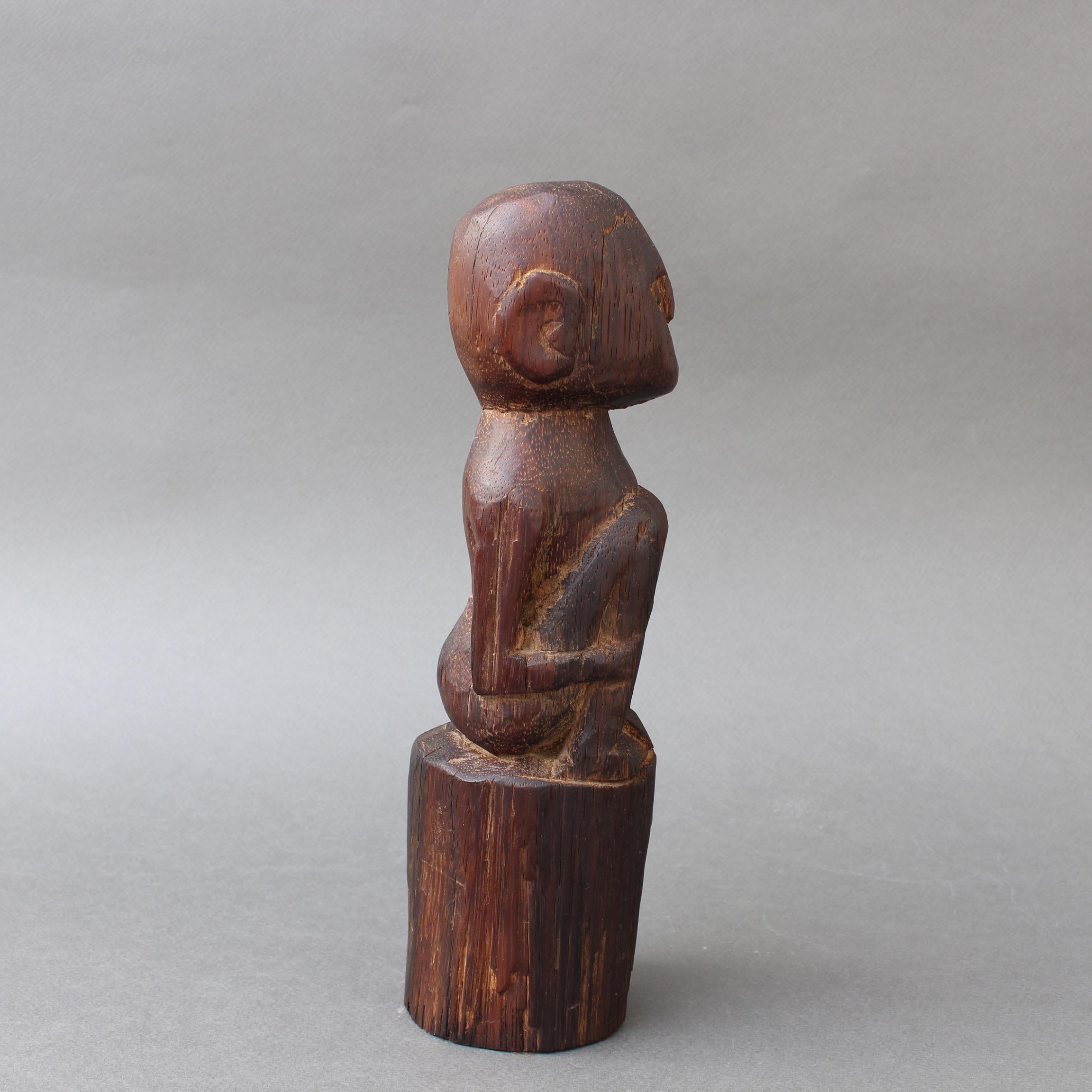 Hand-Carved Wooden Sculpture or Carving of Sitting Figure from Sumba Island, Indonesia