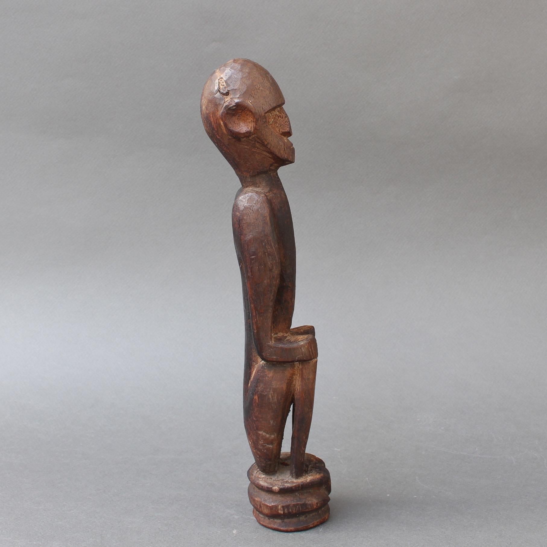 Hand-Carved Wooden Sculpture or Carving of Sitting Figure from Sumba Island, Indonesia