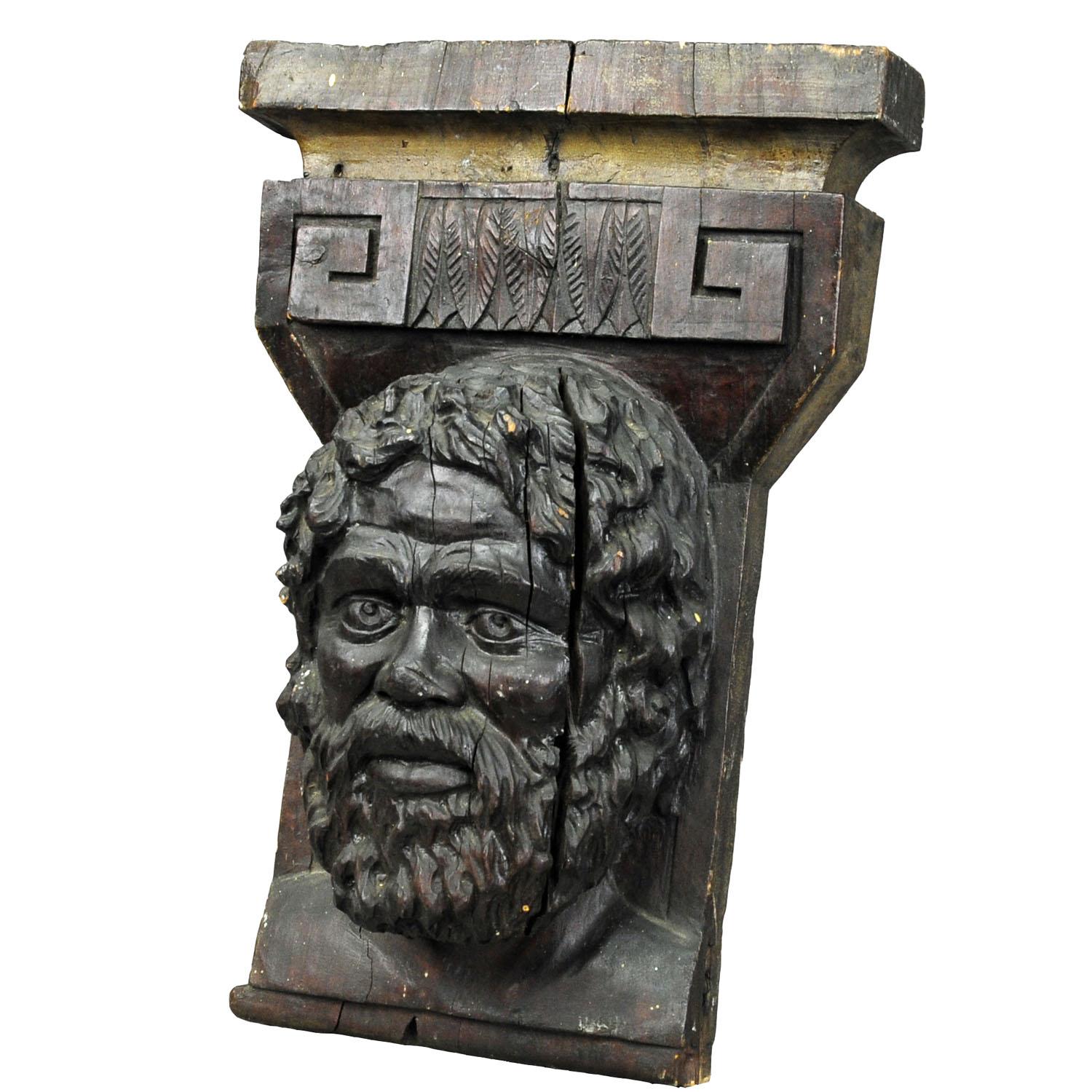 Wooden sculpture of a masculine face.

A highly detailed antique sculpture of a male face. It is an impressive wall decoration consisting of handcarved and stained wood.

Measures:
Width: 13.78